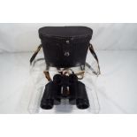 A pair of cased binoculars stamped 8 x 30 Made in the USSR Est £20 - £40