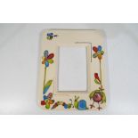 Moorcroft Pottery - a large modern photograph frame decorated in the Stitch in Time pattern,