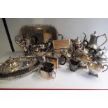 A very large quantity of plated tableware to include serving plates, teapots,