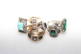 Seven Art Deco style rings including one set in gold