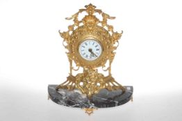 Gilt metal mantel clock on marble base