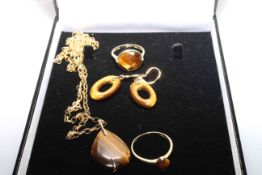 Suite of gold mounted tiger eye jewellery