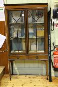 Edwardian mahogany and string inlaid china cabinet having two glazed doors above two drawers on