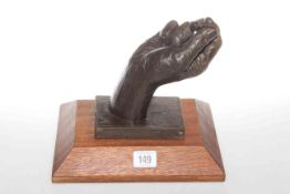 Sculpture of a closed hand, signed J.
