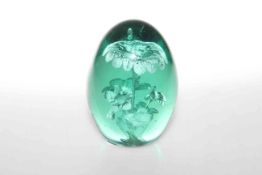 Large green glass dump with internal flowers