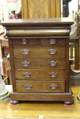 Late Victorian miniature chest of seven drawers on bun feet, 70cm by 53.