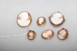 Four cameo brooches and two rings,
