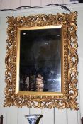Ornate gilt framed rectangular wall mirror,