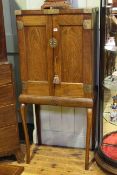 Hardwood and brass mounted collectors cabinet having two panelled doors enclosing a series of