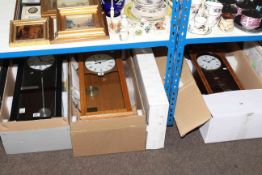 Four boxed as new wall clocks, two by London Clock Company,