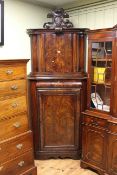 19th Century Beidermeier mahogany shaped front double corner cupboard with armorial crest,