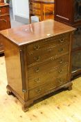 Georgian mahogany five drawer Bachelors chest with reeded quarters on ogee bracket feet,
