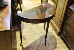 Mahogany demi lune side table on reeded legs, 71.