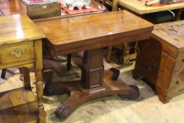 19th Century mahogany fold top card table on pedestal quadriform base