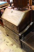 Georgian mahogany four drawer bureau on bracket feet,