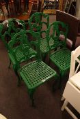 Set of four green lattice work seat patio chairs