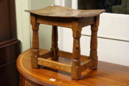 Robert Thompson 'Mouseman' 1930's dished top stool, 37cm by 40.