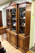 Bevan & Funnel mahogany breakfront cabinet bookcase having arched pediment above three astragal