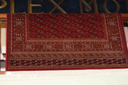 Bokhara carpet with a red ground 2.30 by 1.