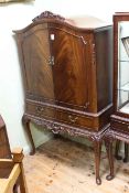 Mahogany arched top two door cocktail cabinet on cabriole legs