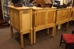 Two similar oak double door cabinets and fall front cabinet (3)
