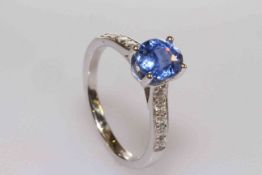 18 carat gold, oval sapphire and round brilliant cut diamond shoulder ring,