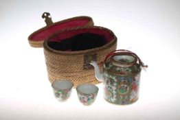 Cantonese Famille Rose teapot and pair of tea bowls in fitted wicker case