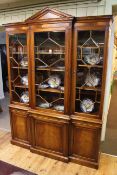 Bevan & Funnell mahogany breakfront cabinet bookcase having arched pediment above three astragal