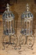 Pair of gilt metal and glazed hall candle lanterns on ornate cast metal bases