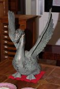 Large cast metal swan with outstretched wings
