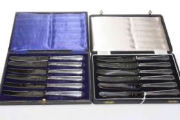 Set of twelve silver handled knives in two boxes