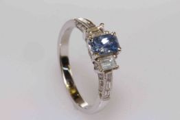 18 carat gold, emerald cut tanzanite and diamond shoulder ring,