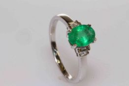 18 carat white gold, oval emerald and baguette diamond shoulder ring,