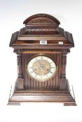 Late Victorian oak cased mantel clock with brass and enamel dial