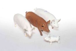 Three Beswick models of pigs and a model of a piglet (4)