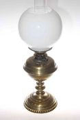 Brass oil lamp with opaque glass shade