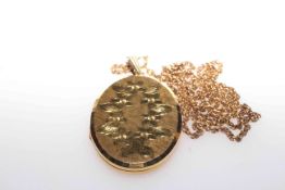 9 carat gold pendant locket, on a chain with clasp stamped 9CT,