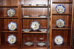 Continental porcelain dessert service containing six tazzas and nine plates decorated with exotic