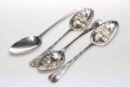 Three Georgian silver later decorated berry spoons and a bright-cut spoon,