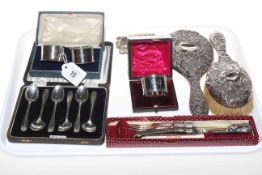 Various silver items including brush and mirror, cased spoons, serviette rings,