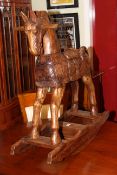 Carved and stained hardwood rocking horse
