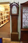 Antique oak 30 hour longcase clock having floral painted arched dial, signed J.