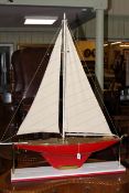 Large model pond yacht on stand complete with sails