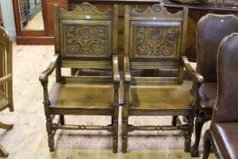 Pair oak carved panel back open armchairs