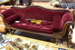 Victorian mahogany double scroll end settee on turned legs in wine coloured fabric