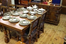 Gomme six piece oak dining suite comprising carved three door sideboard,