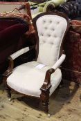 Victorian mahogany open armchair in light buttoned fabric
