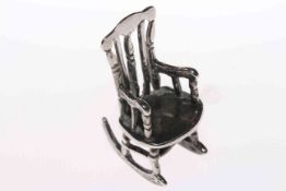 Silver miniature model of a rocking chair,