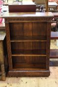 Victorian carved oak open bookcase with three adjustable shelves,