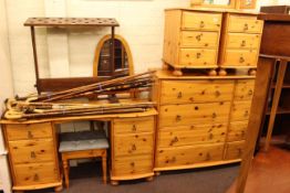 Pine seven piece bedroom suite comprising eight drawer chest, pair three drawer pedestal chests,